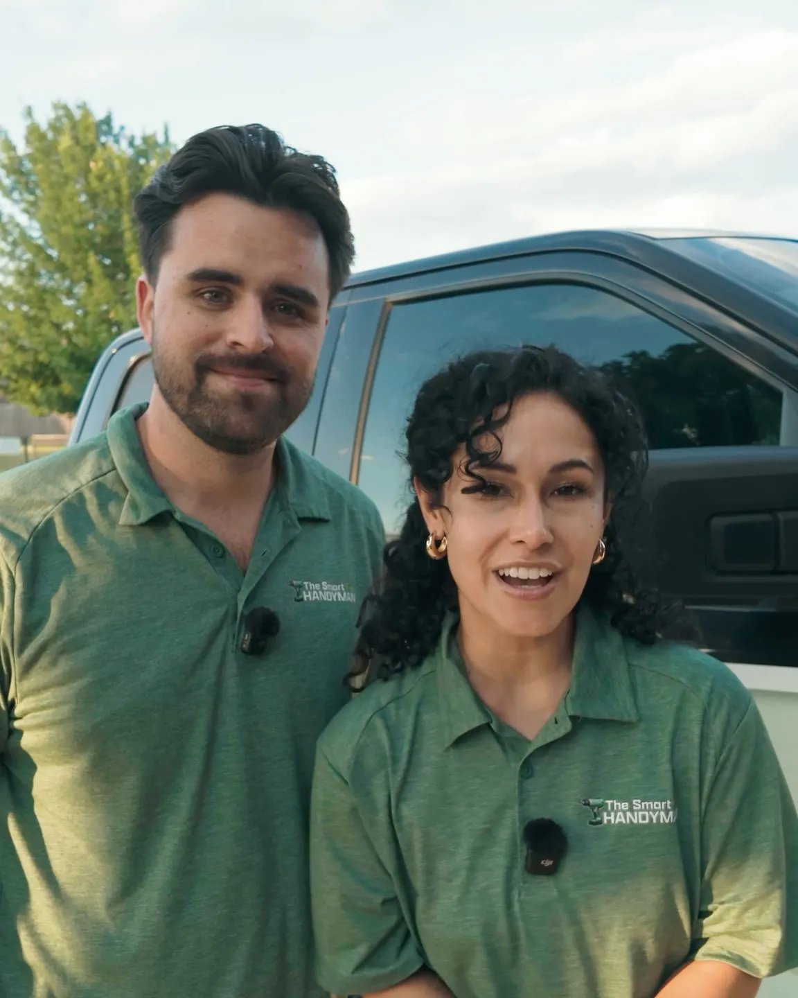 Co-founder Chance O'Shel and his wife, Haley, in green Smart Fix polos beside a company truck