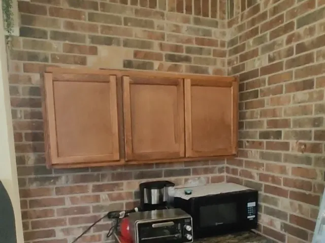 Brick patio wall cabinet installation