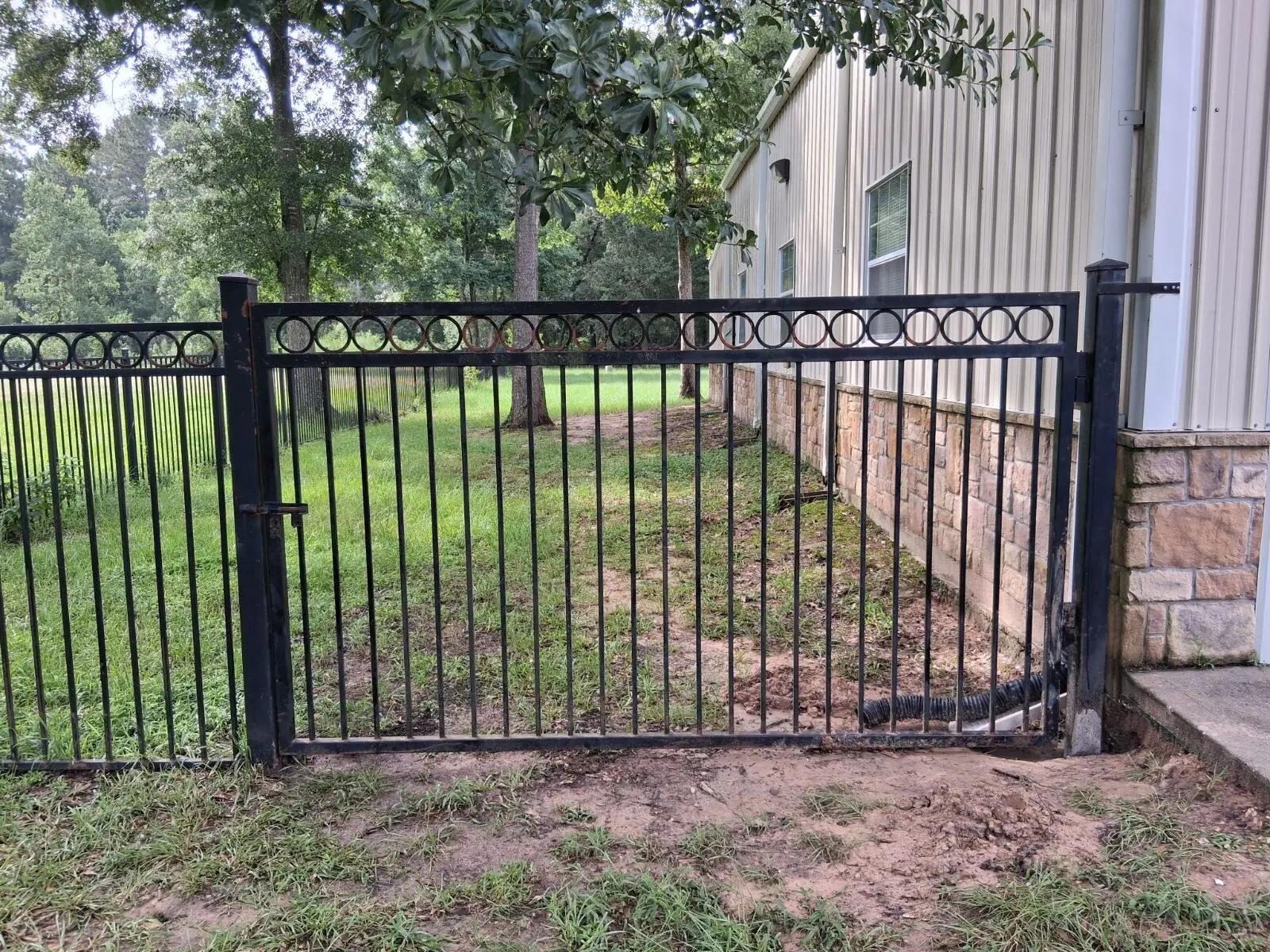 Metal Gate Post and Hinge Repair in New Caney, TX, completed by The Smart Fix Handyman