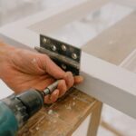Handyman at work repairing a Houston home window