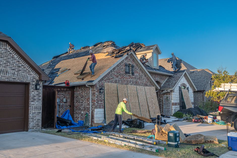 Contractor working on a brick home in Fort Worth, Texas