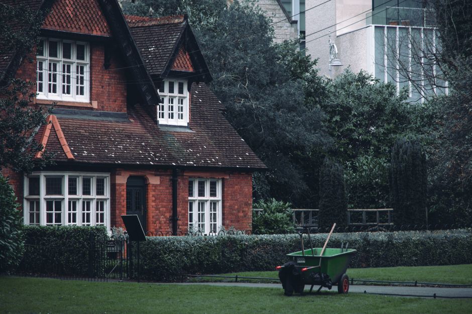Spring home maintenance checklist for Dallas homeowners - brick house with garden